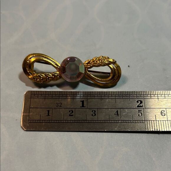 Elegant Gold Infinity Brooch - Picture 2 of 4